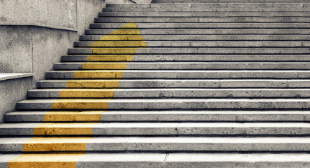 Stone staircase. Steps made of stone slabs. An up arrow is drawn on the steps. Concept of business development and career growth.