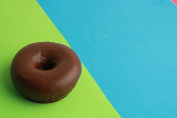 Poster - chocolate bagel on colorful background