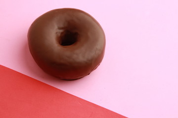 Poster - chocolate bagel on colorful background