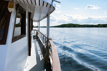 Beautiful view from the deck of the cruise ship going up the Lake Saimaa, Lappeenranta, Finland on a warm sunny day.