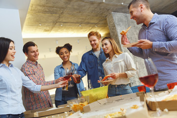 Wall Mural - Group of friends having party indoors fun together celebrating christmas casual