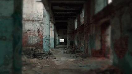 Wall Mural - Movement along corridor of ruined abandoned eerie pillar industrial building with blurred vignette