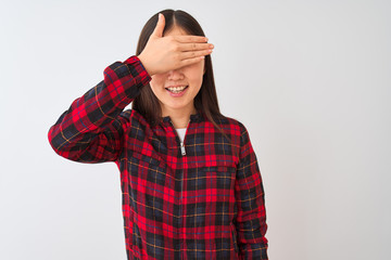 Sticker - Young chinese woman wearing casual jacket standing over isolated white background smiling and laughing with hand on face covering eyes for surprise. Blind concept.