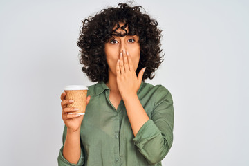 Poster - Young arab woman with curly hair drinking cup of coffee over isolated white background cover mouth with hand shocked with shame for mistake, expression of fear, scared in silence, secret concept