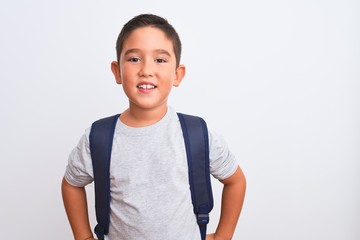 Beautiful student kid boy wearing backpack standing over isolated white background with a happy and cool smile on face. Lucky person.