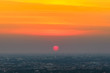 © bookybuggy - Sunrise sunset in the city with selective focus on the sun