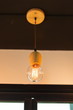 © Rattanachai - vintage hanging light lamp decorate room interior .