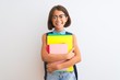 © Krakenimages.com - Beautiful student child girl wearing backpack glasses books over isolated white background with a happy face standing and smiling with a confident smile showing teeth