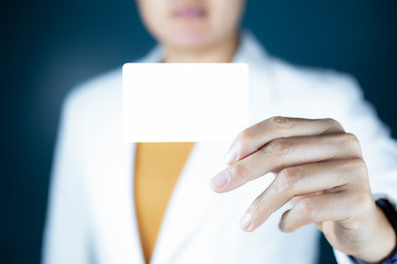 Hand holding  a blank piece of paper. Close up  white business card.