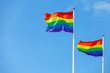 © Johnér - Rainbow flags against sky