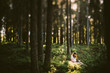 © Johnér - Woman sitting in forest