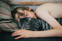 Boy Sleeping With Cat