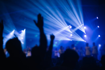 Wall Mural - soft focus of Christian worship with raised hand,music concert
