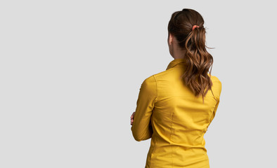 businesswoman is looking away. Back view