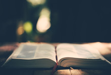 Soft Focus Open Holy Bible On Wood Table With Copy Space.