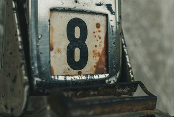 Day 8 number on metal rusty vintage calendar. Bad day concept.