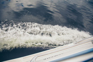 Wall Mural - the concept of boating, relaxing at sea - splashes of blue water in the sea close-up