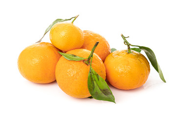 Wall Mural - Tangerines with leaves on a white background