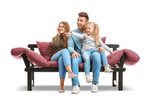 Happy Young Family Sitting On Sofa Against White Background