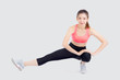© NT_studio - Beautiful portrait young asian woman fitness with stretching leg isolated on white background, asia girl workout with full body exercise and warm up, body care and healthy concept.