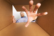 © ronstik - smiling man looking inside the box and reaching for goods