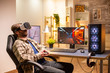 © DC Studio - Professional gamer man using VR headset to play on powerful PC