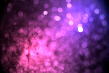 Abstract Purple Bokeh With Black Background Defocused.