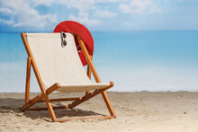 Beach Deck Chair On A Sandy Beach By The Sea. Summer Mood. Space To Copy
