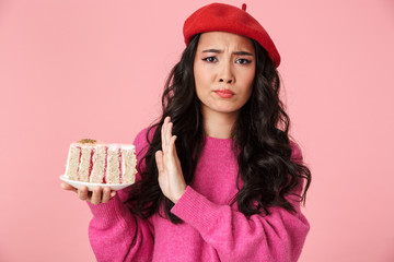 Canvas Print - Image of asian girl doing no gesture while holding piece of cake