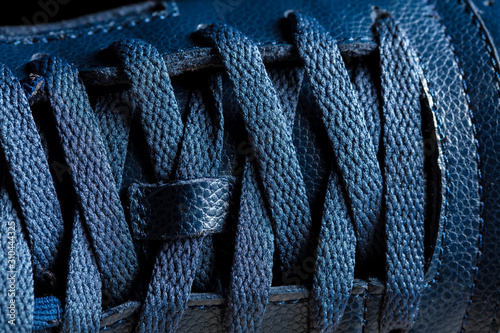 Fotomural Part of a blue boot with laces