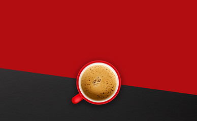 cup of coffee on red background. top view