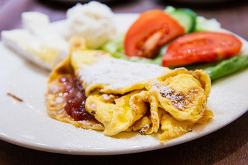 omelet with ham tomato and green salad