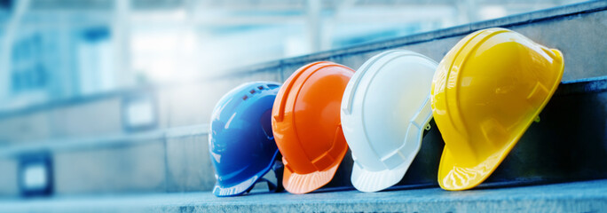 multicolored safety construction worker hats. teamwork of the construction team must have quality. w