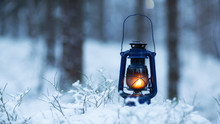 Mystical Scene With Old Kerosene Lamp In Snow. Fairy Abstract Scene. Magic Vintage Lantern Lighting. Copy Space
