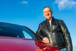 © Edler von Rabenstein - Man is standing next to his car