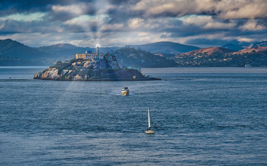 Canvas Print - Two boats leaving Alcatraz with Spotlight Shining