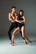 © LIGHTFIELD STUDIOS - attractive and handsome dancers dancing contemporary on dark background