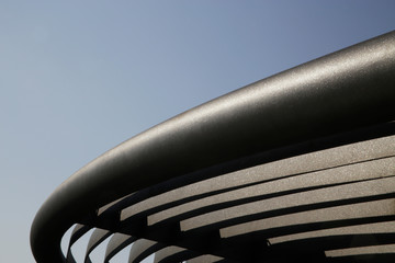 Poster - Metal girders. Curved detail of industrial building. Steel lath structure. Abstract modern architecture. Anti-corrosion protective powder coating. Geometric background with parallel lines and curves.