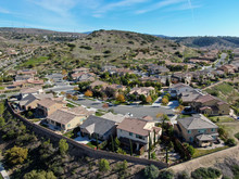 Aerial View Of Neighborhood With Residential Modern Subdivision Luxury Houses And Small Road During Sunny Day In Chula Vista, California, USA.