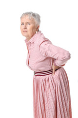 Poster - Senior woman suffering from back pain on white background