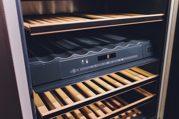 Empty Wine fridge in a kitchen home rack.