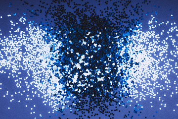 Sticker - Blue sparkles on monochrome background. Top view