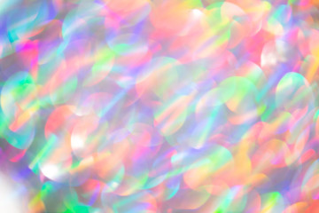 Blurred background with holographic sparkles and lights.