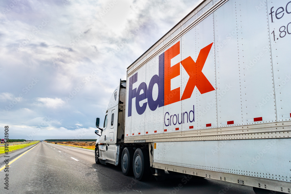 Dec 8, 2019 Los Angeles County / CA / USA - FedEx Ground truck driving on the interstate