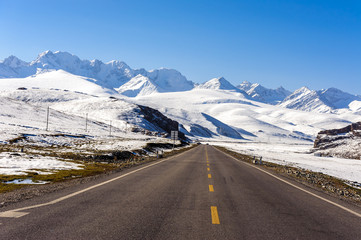 Wall Mural - Snow mountain and road in Xinjiang, China