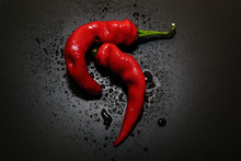 Chili Peppers On A Black Background