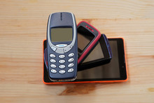 Old Used Mobile Phones On Wooden Floors, E-waste Is A Problem With Environmental Concepts Should Be Reused And Recycle
