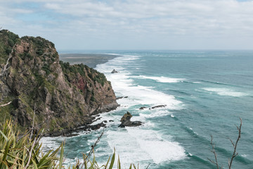 View of Farley Point rocks from Te Ahua Point lookout with Karekare beach in background