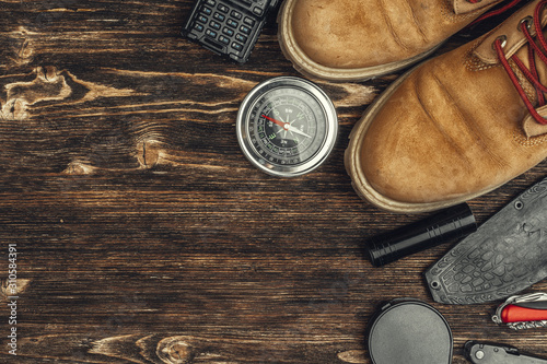 Cuadros en Lienzo Hiking boots, compass and knife. Hiking outdoor equipment