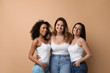© New Africa - Group of women with different body types on beige background
